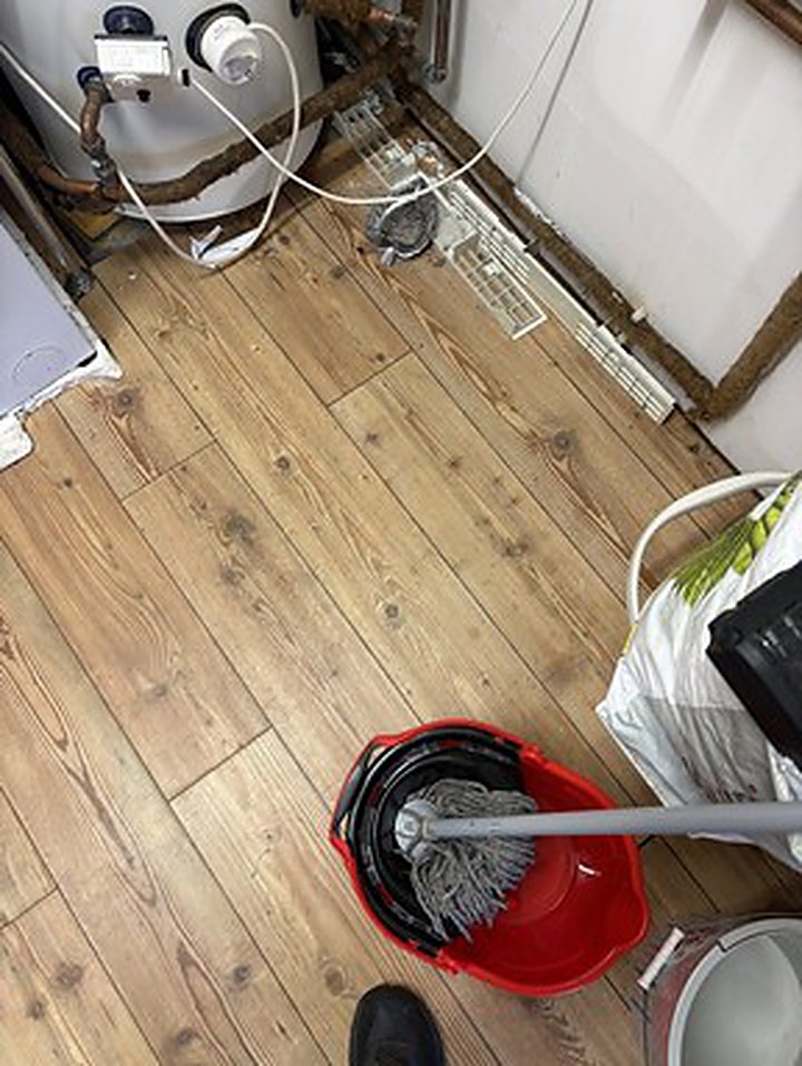 Hot water cylinder pipework isolated in an Ashford garage after a failed expansion vessel flooded the floor