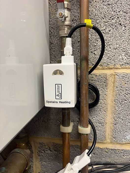 EPH 2-port motorised zone valve labelled Upstairs Heating, fitted on copper pipework beside a boiler in Virginia Water